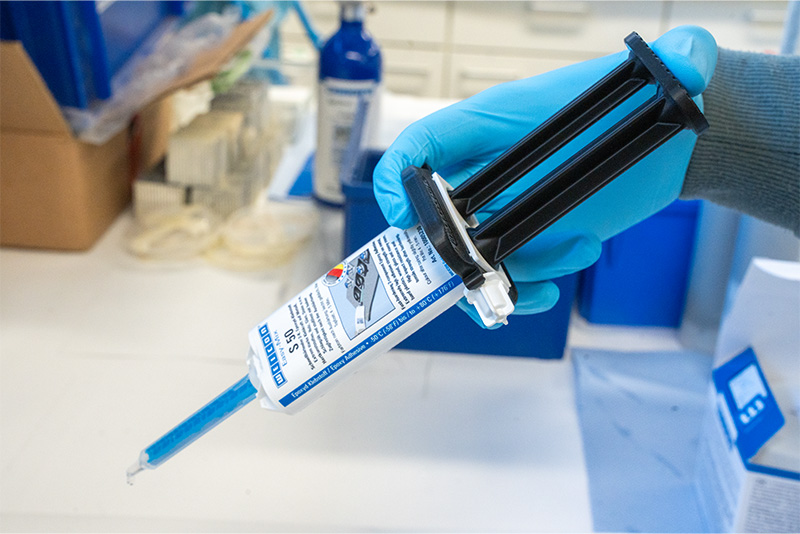 glove, blue syringe, gloved hand, dispensing syringe, lab equipment